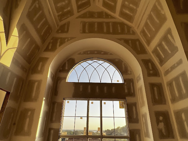 A large arched window in a building